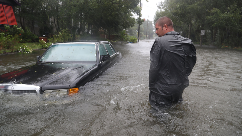 Nick Lomasney walks through heavy wind and a flooded street as Hurricane Matthew passes through the area on October 7, 2016 in St Augustine, Florida. Florida, Georgia, South Carolina and North Carolina all declared a state of emergency in preparation of Hurricane Matthew. (Image: Getty)
